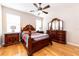 Main bedroom with hardwood floors and wooden furniture at 3447 Poneta Ave, New Smyrna Beach, FL 32168