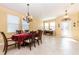 Spacious dining area with a table, chairs, and decorative accents at 3447 Poneta Ave, New Smyrna Beach, FL 32168