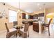 Kitchen with breakfast nook and dark wood cabinets at 3447 Poneta Ave, New Smyrna Beach, FL 32168