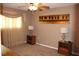 Relaxing bedroom featuring carpet floors, ceiling fan, and warm lighting, inviting a peaceful night's rest at 400 Oakridge Blvd # 6, Daytona Beach, FL 32118