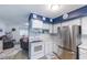 Kitchen features white cabinets and stainless steel appliances at 4744 S Peninsula Dr, Ponce Inlet, FL 32127