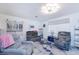 Relaxing living room with comfy armchairs and decorative shelves at 4744 S Peninsula Dr, Ponce Inlet, FL 32127