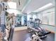 Brightly lit exercise room with various machines and equipment at 701 N Atlantic Ave # 202, New Smyrna Beach, FL 32169