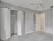 Bedroom with gray walls, carpet, and large closet at 798 E 11Th Ave, New Smyrna Beach, FL 32169