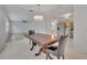 Dining area with wood table and chairs, open to the kitchen at 798 E 11Th Ave, New Smyrna Beach, FL 32169