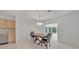 Dining room with chandelier and access to the Florida room at 798 E 11Th Ave, New Smyrna Beach, FL 32169