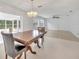 Bright dining area with a view of the living room and Florida room at 798 E 11Th Ave, New Smyrna Beach, FL 32169