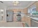 Bright kitchen featuring stainless steel appliances and light wood cabinets at 798 E 11Th Ave, New Smyrna Beach, FL 32169