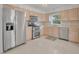 Bright kitchen featuring stainless steel appliances and light wood cabinets at 798 E 11Th Ave, New Smyrna Beach, FL 32169