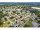 Overhead view of the home in a leafy community with mature trees and manicured lawns at 1277 Harms Way, Port Orange, FL 32129