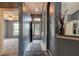 Inviting entryway featuring tile flooring, gray walls, archways, and decorative lighting at 1277 Harms Way, Port Orange, FL 32129