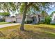 Charming home with manicured lawn, inviting entrance, and two-car garage at 1277 Harms Way, Port Orange, FL 32129