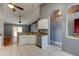 Bright kitchen featuring white cabinets, stainless steel appliances, and an open design at 1277 Harms Way, Port Orange, FL 32129