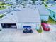 Aerial view showcasing ample parking with a garage, golf cart, and two cars on the property at 452 Lime Ave, Daytona Beach, FL 32124