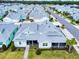 Aerial view of a colorful community with manicured lawns and consistent architectural styles at 452 Lime Ave, Daytona Beach, FL 32124