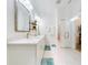 Bright bathroom featuring double vanity, shower, framed mirrors, and modern fixtures at 452 Lime Ave, Daytona Beach, FL 32124