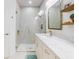 Bathroom featuring shower, vanity, framed mirror, and modern fixtures at 452 Lime Ave, Daytona Beach, FL 32124