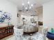 Open dining area view to kitchen with stainless appliances, kitchen island, and hardwood floors at 452 Lime Ave, Daytona Beach, FL 32124
