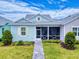 Charming single-story home with a well-manicured lawn and inviting walkway to the screened porch at 452 Lime Ave, Daytona Beach, FL 32124