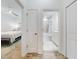 Hallway view leading to a bedroom and bathroom, showing the clean and modern design of the home at 452 Lime Ave, Daytona Beach, FL 32124