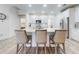 Kitchen with white cabinetry, stainless steel appliances, and breakfast bar with seating at 452 Lime Ave, Daytona Beach, FL 32124