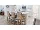Kitchen with a marble counter top island and stainless steel appliances at 452 Lime Ave, Daytona Beach, FL 32124
