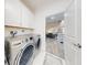 Laundry room featuring stainless steel appliances and storage at 452 Lime Ave, Daytona Beach, FL 32124
