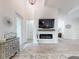 Inviting living room featuring an electric fireplace, wood floors, and a glimpse into the adjoining rooms at 452 Lime Ave, Daytona Beach, FL 32124