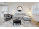 Bright living room featuring vaulted ceilings, a cozy gray sofa, and a stylish area rug at 452 Lime Ave, Daytona Beach, FL 32124