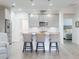 Modern kitchen featuring stainless steel appliances, a large island, pendant lighting, and stylish barstools at 456 Lime Ave, Daytona Beach, FL 32124