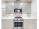 Modern kitchen featuring stainless steel appliances, light gray cabinets, and white countertops at 456 Lime Ave, Daytona Beach, FL 32124