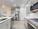 Spacious kitchen with stainless steel appliances, light gray cabinets, and hard surface floors at 456 Lime Ave, Daytona Beach, FL 32124