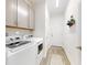 Clean and organized laundry room with modern washer and dryer, ample storage, and bright lighting at 456 Lime Ave, Daytona Beach, FL 32124