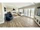 Bright and airy living room with comfortable seating and large sliding glass doors to the balcony at 501 N Causeway # 2050, New Smyrna Beach, FL 32169