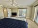 Spacious main bedroom with ensuite bathroom, balcony access, and large windows at 501 N Causeway # 2050, New Smyrna Beach, FL 32169