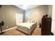 Cozy bedroom with plush carpeting, neutral paint, and a bright window providing natural light at 510 Sun Lake Dr, Port Orange, FL 32127