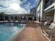 Relaxing pool area with patio furniture at 5300 S Atlantic Ave # 7-502, New Smyrna Beach, FL 32169