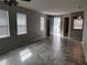 Spacious living room featuring tiled floors and ample natural light at 617 Aeolian Dr, New Smyrna Beach, FL 32168