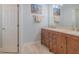 Elegant bathroom boasts a double vanity with beautiful wood cabinetry and stylish decor at 682 Middlebury Loop, New Smyrna Beach, FL 32168