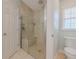 Modern bathroom features a glass enclosed shower with a built-in seat and tiled walls at 682 Middlebury Loop, New Smyrna Beach, FL 32168