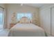 Bright bedroom featuring a window, closet, and coastal themed decor at 682 Middlebury Loop, New Smyrna Beach, FL 32168
