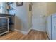Features a wine cooler, shelves, and a granite countertop, perfect for entertaining in a cozy dining area at 682 Middlebury Loop, New Smyrna Beach, FL 32168