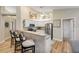 Bright kitchen with breakfast bar, stainless steel appliances, and seating for three at 682 Middlebury Loop, New Smyrna Beach, FL 32168