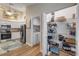 Open kitchen view showcases the pantry and adjacent laundry room with a white washer at 682 Middlebury Loop, New Smyrna Beach, FL 32168