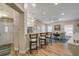 View of living room from the entry showcasing an open floor plan and counter seating at 682 Middlebury Loop, New Smyrna Beach, FL 32168