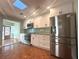 Renovated kitchen with stainless steel appliances and granite counters at 115 E Turgot Ave, Edgewater, FL 32132