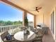 Spacious balcony with ceiling fan provides great views and comfortable outdoor seating area at 253 Minorca Beach Way # 205, New Smyrna Beach, FL 32169