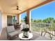 Relaxing balcony offers ample seating and beautiful views of the surrounding greenery at 253 Minorca Beach Way # 205, New Smyrna Beach, FL 32169