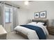 Tastefully decorated bedroom with large window and comfortable king-size bed at 253 Minorca Beach Way # 205, New Smyrna Beach, FL 32169