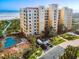 Luxury condo with a pool, manicured landscaping and beach access provides great curb appeal at 253 Minorca Beach Way # 205, New Smyrna Beach, FL 32169